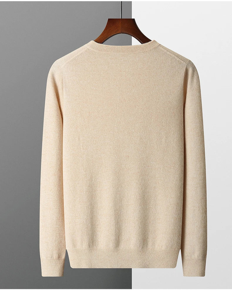Brexton beige men's merino wool sweater on a hanger facing backwards against a gray background