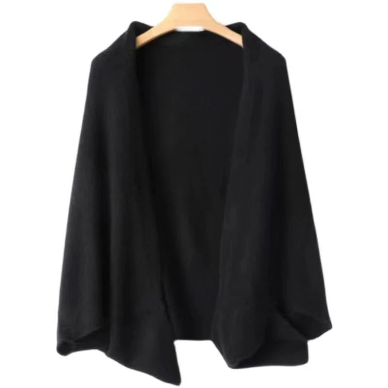 Black wool wrap shawl on a wooden hanger against a white background
